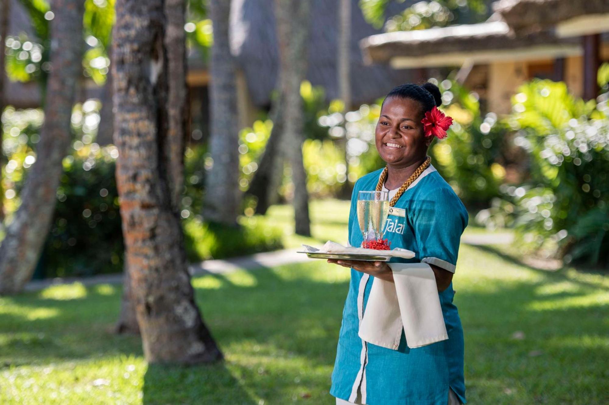 Outrigger Fiji Beach Resort Korotogo Extérieur photo A hotel staff in Mauritius